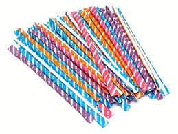 Colorful powdered candy sticks with fruity sugar spilling out, highlighting the sweet and tangy candy flavor.