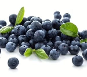 Fresh blueberries mixed with raspberries, strawberries, and blackberries, highlighting the sweet berry flavor blend.