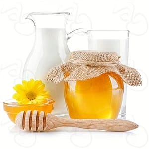 A drizzle of golden honey flowing into a glass of fresh milk, highlighting the sweet and creamy flavor combination.