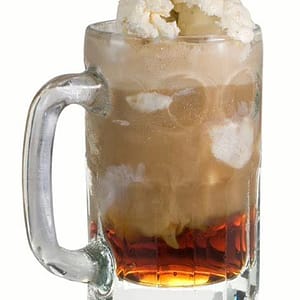 A tall glass of root beer float topped with vanilla ice cream and frothy foam, highlighting the sweet and creamy soda flavor.