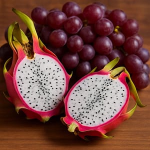 Fresh dragonfruit halves paired with clusters of juicy grapes, highlighting the exotic and bold fruit blend.