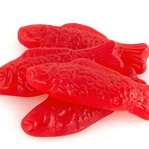 Classic red Swedish Fish gummy candies, highlighting their sweet and fruity candy flavor.