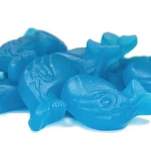 Blue whale-shaped gummy candies with a glossy finish, highlighting their sweet and fruity candy flavor.