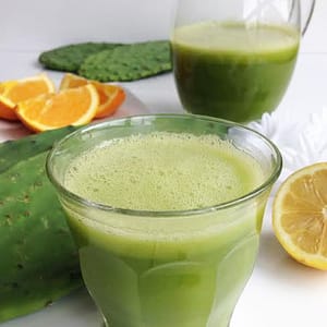 Fresh prickly pear cactus fruit with splashes of citrus and melon, highlighting the exotic and refreshing flavor blend.